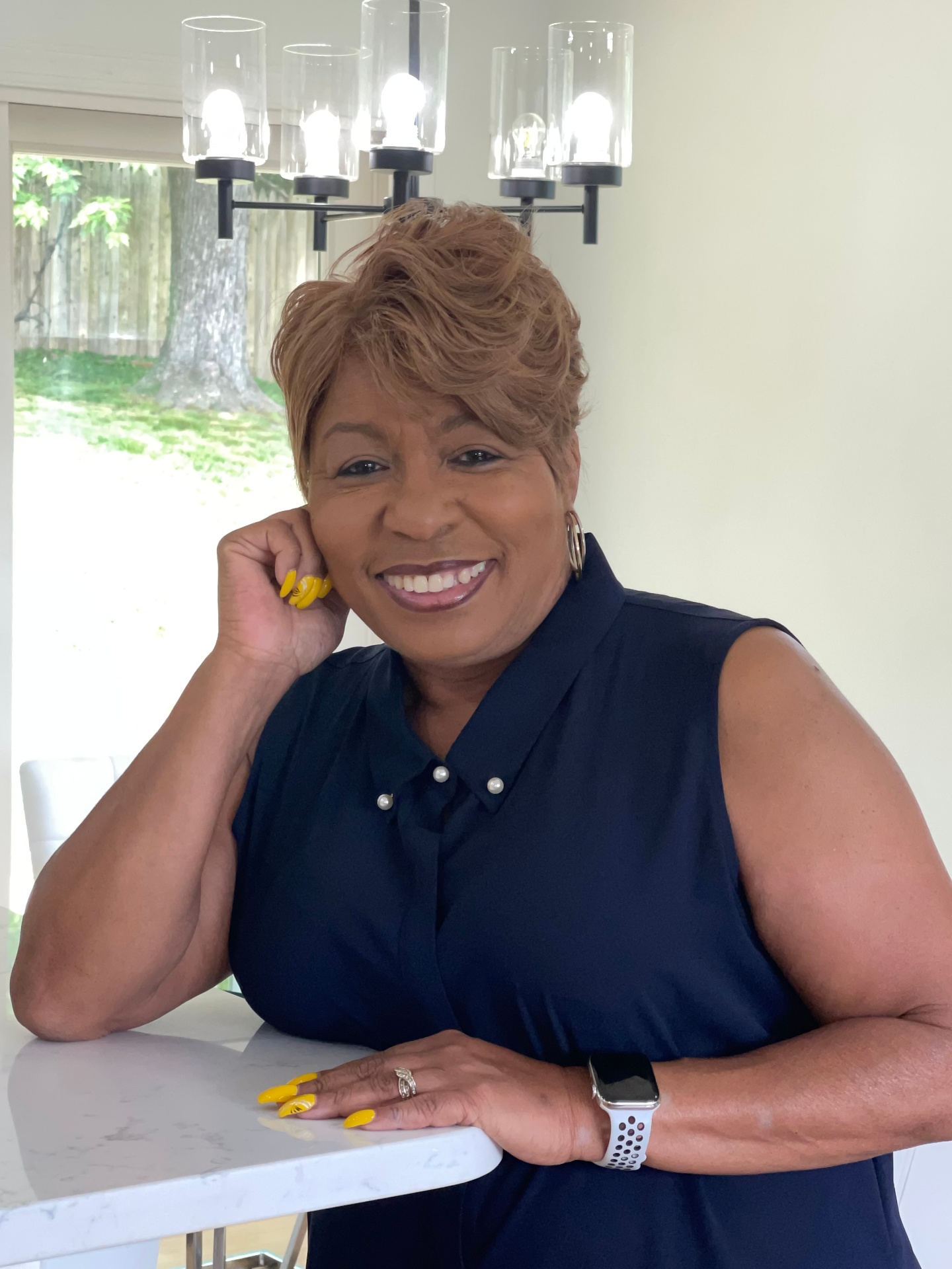 Dee Willard-Ruffin at home, smiling warmly
